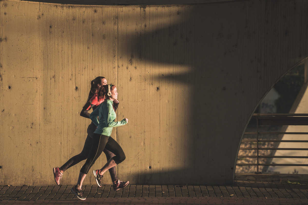 healthy-women-enjoying-sport-sunset